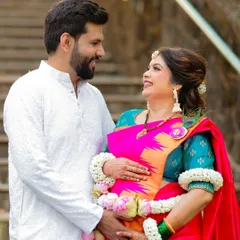 A beautiful portrait of an expecting couple during their traditional Dohale Jevan. The vibrant colors of their outfits and the genuine smiles make this a cherished memory.