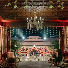 A view from the dining area looking towards the wedding mandap, showing how we integrate traditional elements throughout the entire event space.