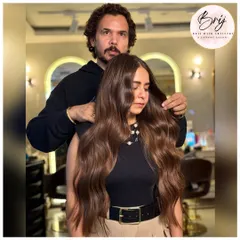 Confidence comes from hair that feels as good as it looks. This rich brown color is styled to perfection, highlighting its depth and dimension.