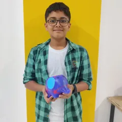 A proud artist with his freshly painted elephant planter. This was part of a super fun animal-themed birthday party.