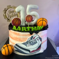 A slam dunk of a cake for a 15th birthday. This basketball-themed cake features an edible sneaker print, fondant basketballs, and the birthday boy's name, perfect for any young athlete.