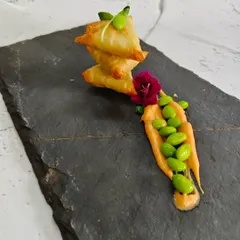 This is where tradition meets innovation. Our Edamame Truffle Samosas feature a golden, crispy pastry filled with creamy edamame and a hint of earthy truffle, creating a bite that is both familiar and surprisingly new.