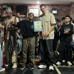 The winner of the B-girl Seven to Smoke battle receives her award. We feature diverse competition formats like 7-to-smoke to keep the battles exciting and challenging for everyone.