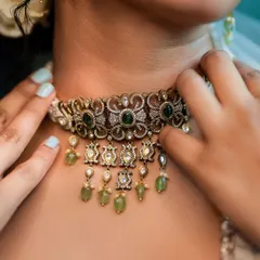 Details matter. This close-up on an ornate choker necklace shows our focus on accessory and jewelry photography. We ensure every element of the styling, from the main outfit to the smallest accessory, gets its moment.