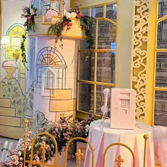 A close-up of the hand-illustrated castle turret and patisserie window from a Parisian fairytale theme. The blend of 2D illustration and 3D structure creates a unique, storybook feel.