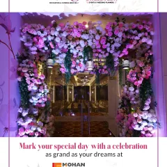 Mark your special day with a celebration as grand as your dreams at Mohan Banquets. We create stunning entrances like this floral archway, welcoming guests into a world of elegance.