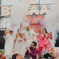 The groom, the bride, and the family all dancing together on the mobile stage. This baraat was an absolute blast with non-stop energy and smoke effects.