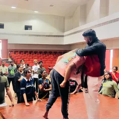 A student practices a defensive maneuver to break free from a hold, a key technique taught in our self-protection program.