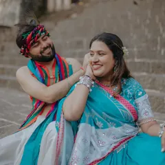A playful and tender moment from a Radha-Krishna inspired pre-wedding shoot. His smile and her joyful expression perfectly capture the spirit of their love.