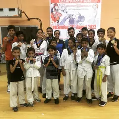 I am incredibly proud of my team from the North Districts Taekwondo Championship 2022. This group photo represents the dedication and success of our students, who consistently bring home medals.