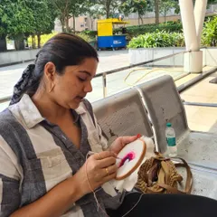 A participant fully engaged in her punch needle project. The repetitive motion is incredibly therapeutic and a great way to practice mindfulness and relieve stress.