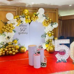For this 50th milestone celebration, I designed a classic and elegant backdrop. The combination of gold and white balloons, paired with large marquee numbers, provides a perfect focal point for cake cutting and photos.