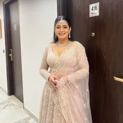 Here's one of my happy clients looking absolutely radiant in our most-loved beige lehenga. It's the perfect elegant choice for a reception or engagement party.