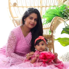 A mother and daughter duo in pretty pink outfits. I offer a selection of matching or coordinating outfits for both moms and babies to make your family portraits even more special.