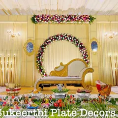 This engagement setup at VSG Mahal features a beautiful floral arch backdrop. My platter arrangements in the front are designed to match the grandeur of the stage.