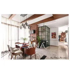The dining area in Apartment 704 showcases our use of material and color to create vibrant living spaces. Exposed brick, a dark green powder room enclosure with fluted glass, and industrial-style lighting come together in a contemporary design.
