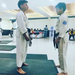 Before any drill, we learn respect. Two of our young students face each other before beginning a self defense demonstration, a core principle of martial arts.