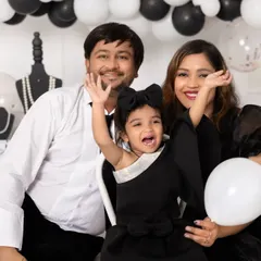 A candid moment of love and laughter during a family photoshoot. We encourage playful interactions to capture the authentic joy and personality of your family.