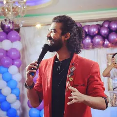 A happy, candid moment on stage, interacting with guests and enjoying the flow of the event.