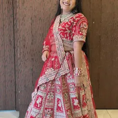 Another angle of our beautiful client in the red doli-baraat rental lehenga. The fit is perfect and she looks ready for her big day.