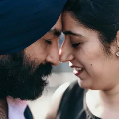 An intimate close-up of a couple, nose-to-nose, sharing a quiet moment. This type of shot captures the deep, unspoken connection between two people.