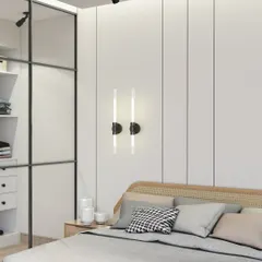 A closer look at the Scandinavian bedroom, highlighting the clean lines of the wall paneling and the modern wall sconces. The glass-paneled wardrobe adds to the airy feel while providing ample storage.