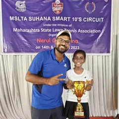 Celebrating with Trisha after her U-10 victory. It's rewarding to see our youngest players achieve their goals.