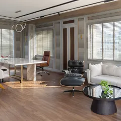 An executive cabin should be a statement of leadership and taste. In this space for EaseMyTrip's MD, I combined soft gray paneling with a commanding marble desk and iconic mid-century furniture. The result is a workspace that is both luxurious and highly functional, filled with natural light to create a calm, focused environment.