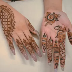 This is a great example of a modern, asymmetrical look. The back of the hand has a simple cuff and finger details, while the palm features a light, floral bail (vine) design.