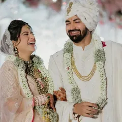 A candid laugh from the bride and groom. Her simple and elegant half updo stays in place throughout the ceremony, allowing her to live in the moment.