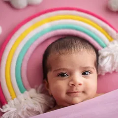 Look at this little rainbow baby looking right at me! Not all babies sleep through their session, and capturing their bright, curious eyes is just as precious.