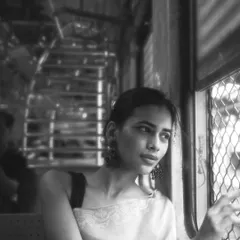 Black and white brings a timeless feel to this train portrait. It strips away the color to focus on the emotion and the play of light through the window.