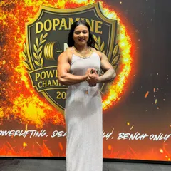 On stage at the Dopamine Powerlifting Championship. This photo captures the focus and determination that drives me to chase my vision.