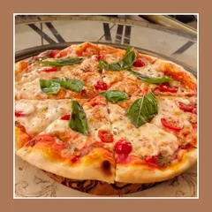 The classic Pizza Margherita, done our way. A thin, crispy crust topped with rich tomato sauce, fresh mozzarella, and basil leaves. Simple, authentic, and delicious.