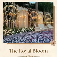 Inspired by royalty, this "Royal Bloom" stage features multiple arches adorned with flowers and elegant chandeliers. The patterned flooring and classic white seating complete a look of grandeur and opulence for your big day.