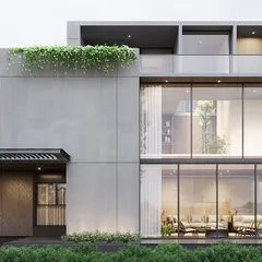 A prototype for a housing master plan in Bangalore, showcasing a modern aesthetic with extensive use of glass to connect interiors with the surrounding landscape. This design emphasizes clean lines and a strong relationship between the built form and nature.