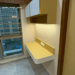To maximize functionality in this room, I designed a compact, floating study desk with overhead storage. The warm yellow and white palette continues here, creating a dedicated workspace that feels integrated with the rest of the bedroom design.