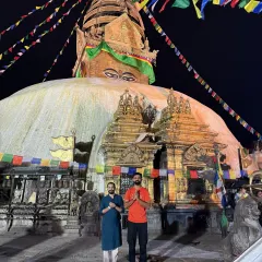 In the quiet of the night, we stand in reverence before the great Bouddhanath Stupa in Nepal. The air is thick with prayer, and the eyes of the Buddha watch over us as we offer our gratitude.