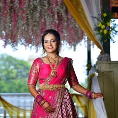 Tanu looking radiant and happy under a beautiful floral canopy at her engagement ceremony.
