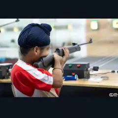 Even our youngest members learn the fundamentals of safe and effective shooting. Here, a young boy takes aim with an air rifle under careful supervision.