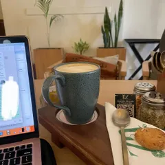 Another work session from a cafe. As an online coach, I have the flexibility to work from anywhere, blending my passion with my lifestyle.