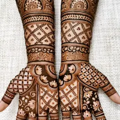 This design showcases my love for intricate jaal, or net patterns. The hands and arms are filled with different styles of check-work, balanced with delicate leafy vines and lotus details.
