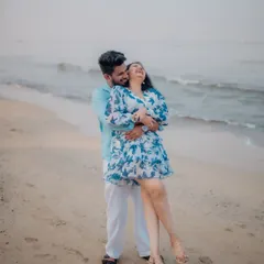 A moment of pure, uninhibited joy on the beach. He lifts her up in a playful embrace, and her laughter is the centerpiece of this candid and heartwarming pre-wedding photograph.