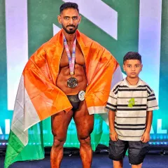 Representing India and winning a silver medal at the NPC Natural Bodybuilding Show in Malaysia. Having my son there to witness it was the real prize. This journey at 43 shows that it's never too late to achieve your dreams.