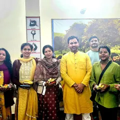 Sharing prasad after the Havan ceremony. These moments of togetherness strengthen the bonds within our Amritam Yoga family.