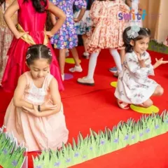 Children perform a choreographed dance for their grandparents. Stage performances like these build confidence and coordination in a fun, supportive environment.
