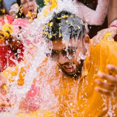 This is what we mean by capturing real moments. The sheer fun and chaos of a Haldi ceremony, frozen in a splash of water and a burst of laughter. This photo shows our candid approach and our love for the unscripted, joyful traditions that make Indian weddings so vibrant.