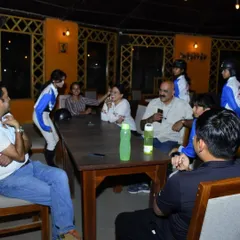 Our riders, coaches, and their families gathering after a training session. This sense of community and shared passion is what makes our academy a special place.