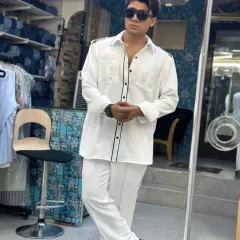 Style that’s relaxed but still makes a statement. This all-white co-ord set with black piping details is custom-made for comfort without compromising on class.