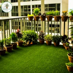 You don't need a huge space to have your own green corner. I turned this Noida apartment balcony into a lush mini-garden using high-quality artificial grass and a curated selection of potted plants that thrive in balcony conditions.